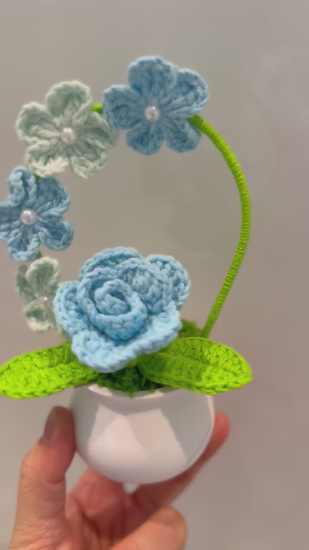 Crochet Blue Rose with Soft Blue-Green Arch – Handmade Yarn Flower Pot